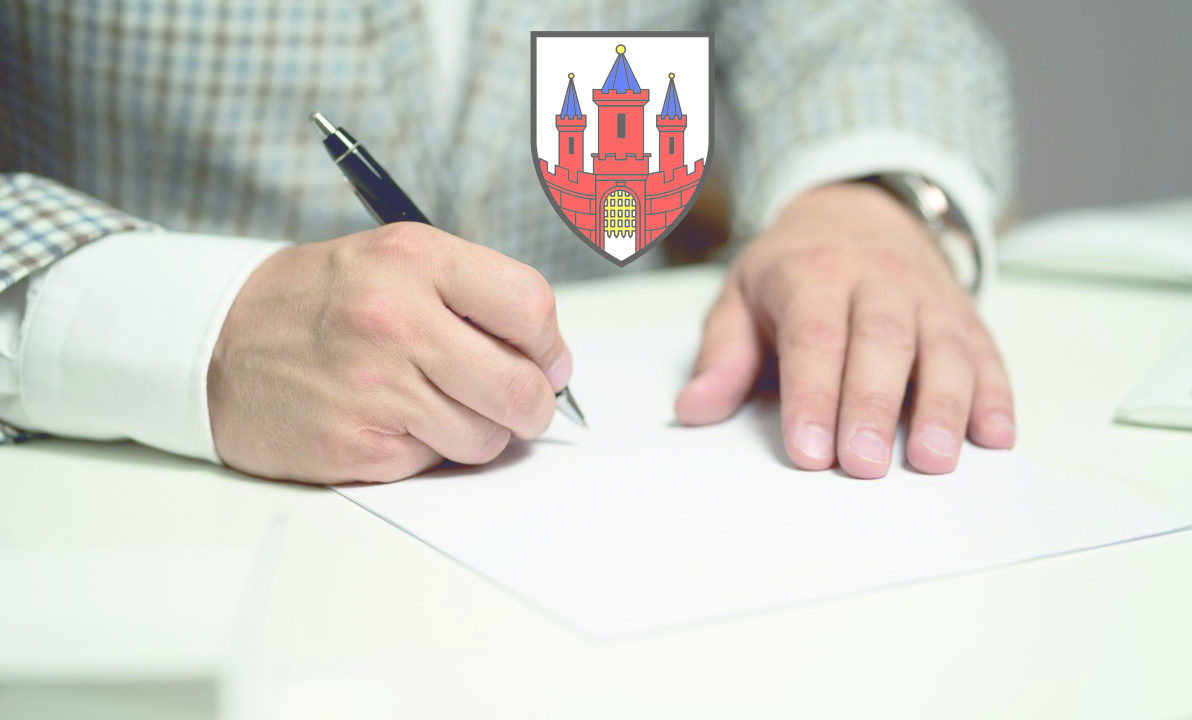 dłonie podpisujące dokument, herb miasta Malbork